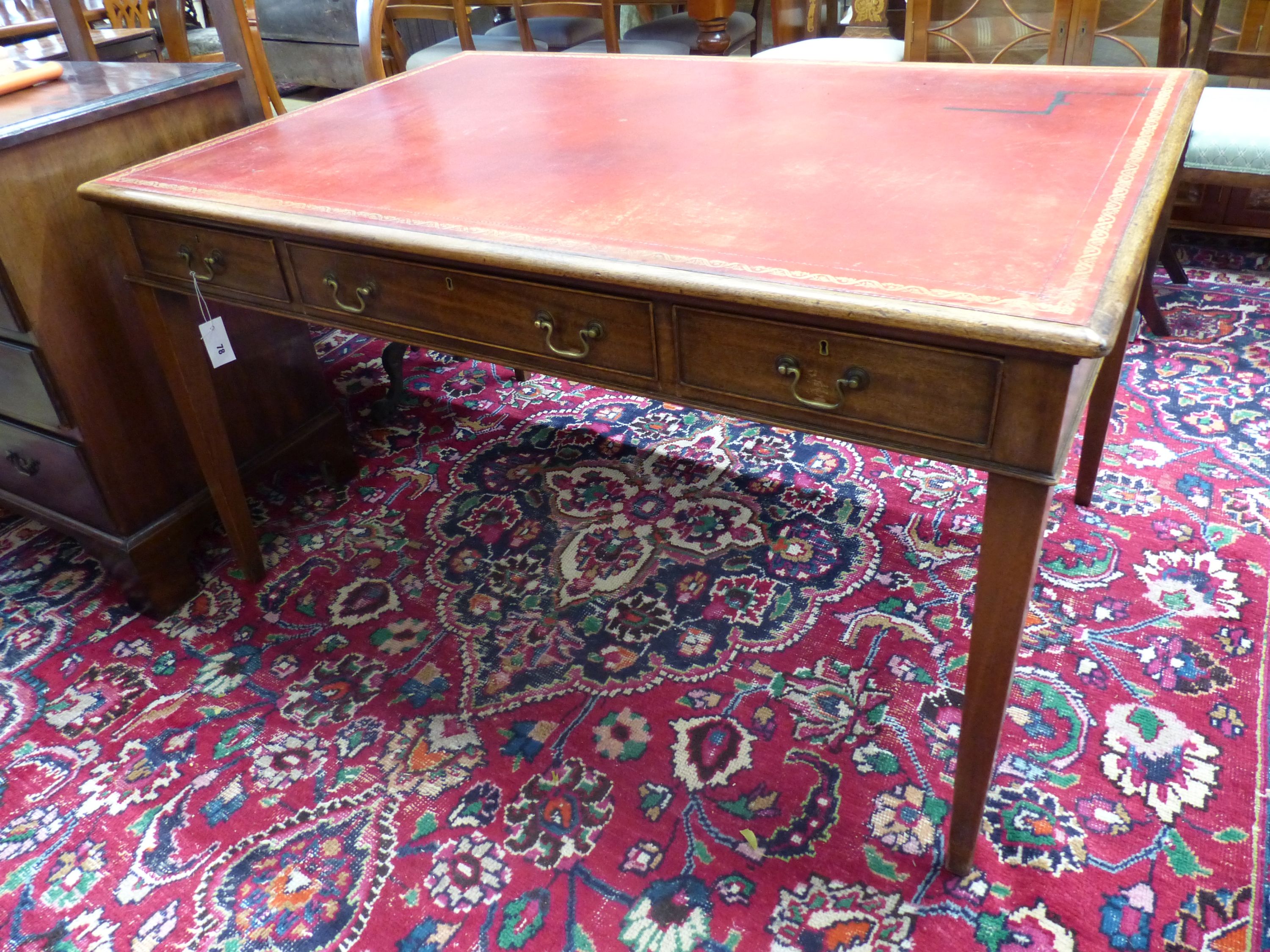 A George III style rectangular mahogany writing table, width 136cm, depth 91cm, height 75cm